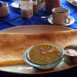 Indian food. Dosa with sambol and cconut chutney. A South Indian dish.
